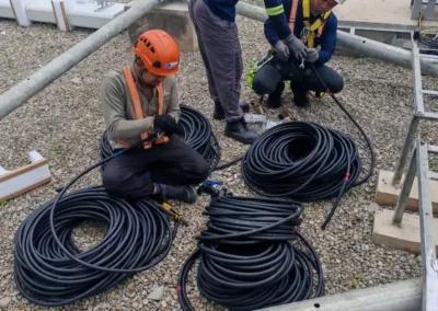 Telecom crew working beside coils of cable